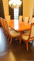 Full view of rectangular dining table and eight chairs
