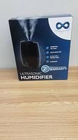 Box of 6-liter ultrasonic humidifier showing brand logo, model features, and warranty on front side.