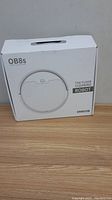 White retail box of OB8s wireless floor cleaning robot vacuum with product image and branding on front.