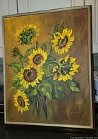 Frontal view of the framed oil painting of sunflowers showing full artwork and frame.