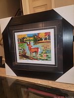 Front view of framed art print with protective corner covers