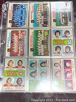 Photo of front sides of assorted 1975-76 O-Pee-Chee NHL trading cards showing team photos and individual player portraits with colorful backgrounds.