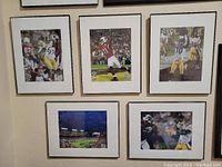 Five framed Super Bowl photographs displayed on wall showing action and stadium shots from Cardinals and Steelers game