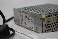 Power supply side label showing model RS-50-12 with input 100-240VAC 1.3A, output 12V 4.2A, certified CE, UL listed, made in China