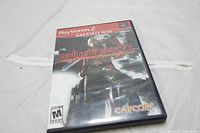 Front cover of Devil May Cry 3 Special Edition PS2 game case showing character Dante with sword and game title.