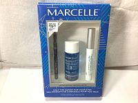 Front of Marcelle limited edition eyes cosmetics set with black mascara, black eyeliner, and eye makeup remover visible inside blister packaging.
