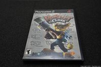 Front view of Ratchet & Clank game case for PlayStation 2 showing the original cover art, rating, and logos.