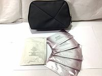 Photo showing black Shiseido cosmetic pouch and six sachets: five Shiseido White Lucent Power Brightening Mask sheets in pink packaging and one white sachet labeled as Qiora Spa Mask DH small size sample with 5 sheets.