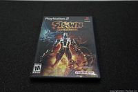 Front cover of Spawn Armageddon game for PlayStation 2 showing game title, cover art, and rating.