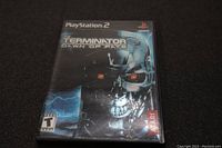 Front cover of The Terminator Dawn of Fate PlayStation 2 game case showing Terminator robot and title.