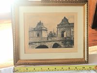 Framed original etching artwork showing the full view with measuring tape for scale, highlighting the gold frame and the mounted etching artwork behind glass.