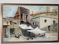 Close-up photo of the original watercolor painting showing detailed architectural elements and subjects.