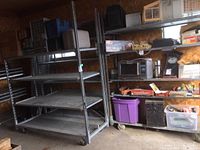 Two units side by side in garage with contents on adjacent rack (not included)