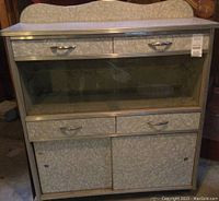 Full front view of the buffet showing drawers, glass doors and cabinet doors