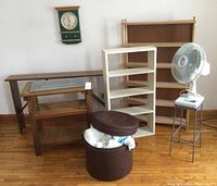 Photo showing all main items in the lot including shelves, fan, and footstool with yarn and afghan
