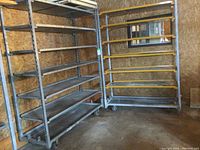 Wide shot showing two shelving units side by side against OSB wall