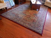 View of full rug in living area with furniture around