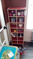Front view of the laminate cubby cabinet with items inside for size reference