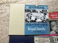 Top view showing 1962 Royal Family calendar and Royalty books including Prince Charles and Princess Anne album.