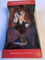 Full view of the Peggy Nesbit Madame du Barry doll in original box showing doll's dress and styling.