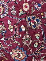 Close-up of claret field with arabesque floral motifs
