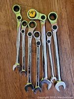 All 7 wrenches arranged together showing both open and ratcheting ends