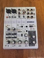 Top view showing front panel with combo mic/guitar inputs, gain knobs, compression/EQ, amp sim, effects buttons, and monitor volume controls.