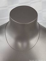 Sterling silver rope style necklace displayed on a mannequin neck to show length and fit.