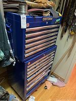 Front view of blue two-piece Craftsman rolling tool cabinet with drawers and Craftsman logo