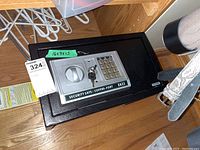 Front top view of the security safe with keypad and two keys inserted.