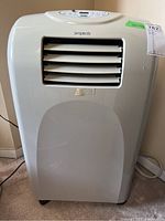 Front view of Simplicity portable air conditioner, white with front air vents, power cord visible.
