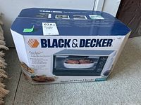 Full view of sealed Black & Decker Toast-R-Oven Classic toaster oven box with brand name and product image.