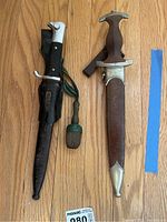 Both letter openers side by side showing front faces, scabbards and portepee