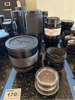 Five lenses arranged together on table