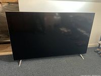 Front view of Vizio M70-C3 on legs showing screen and bezel