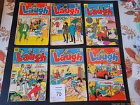 Front cover of six Laugh Archie Series comic books showing colorful cartoon scenes and characters.