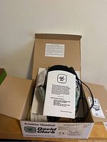 Open David Clark headset box showing contents: headset, manuals, packaging