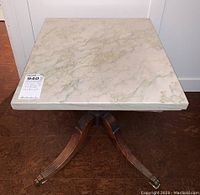 View from top showing square marble stone top with veining.