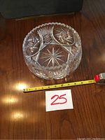 Top view showing detailed starburst and geometric cut patterns inside the salad bowl with scalloped rim.