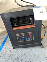 Front view of EdenPURE Classic small area heater with visible heating element and dust on top.
