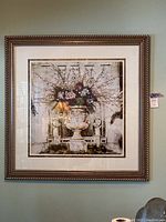 Full view of framed artwork hung on wall showing full composition and frame style