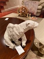 Front side view of the white porcelain Royal Dux polar bear figurine showing detailed fur texture and facial features.