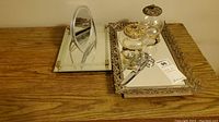 The entire lot arranged on wooden surface showing trays, jars, mirror, and scissors.