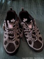 Top view of pair of men's Wenger Swiss Military shoes, black and grey color, size 9, showing laces and branding on tongue and insole.
