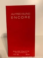 Front view of red box with silver lettering showing Alfred Sung Encore Eau de Toilette 1 fl oz 30 ml.