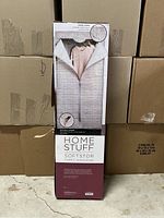 Front view of tall, rectangular fabric wardrobe box showing open zipper and sweater inside on packaging illustration.