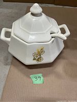 Full view of white octagonal terrine bowl with lid and ladle, showing floral wheat and daisy design.