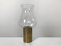 Mid century Danish oil lamp fully assembled with glass chimney, brass body, and oil canister inside.