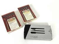 Two boxed sets of demitasse spoons with vintage labels and one box of Royal Copenhagen Complet serving pieces.