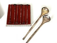 Pair of silver plate salad servers with long handles showing tarnish.